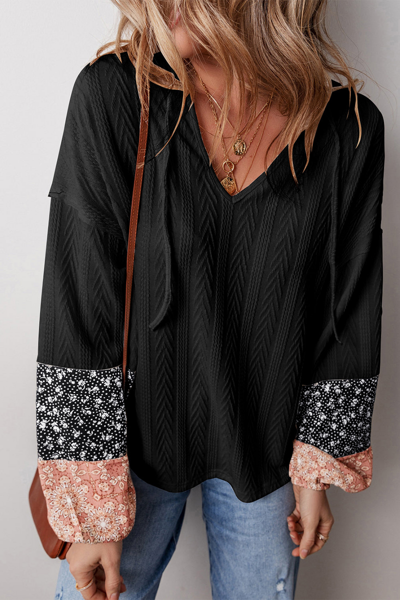 Elevate Your Style with the Black Floral Patchwork Textured Knit Drawstring V Neck Blouse