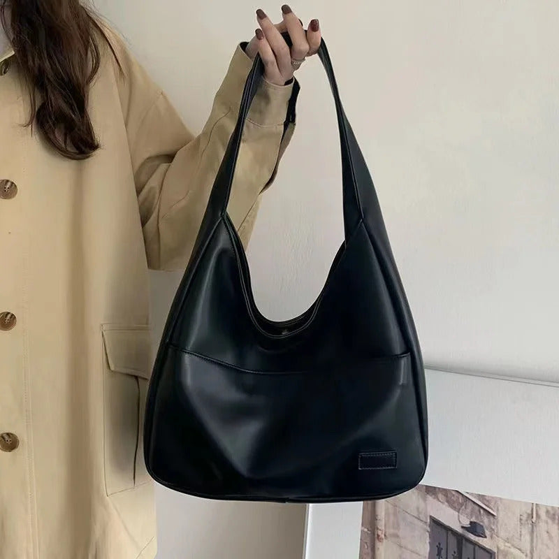 Large capacity tote bag, new black leather simple casual commuting women's bag, fashionable and versatile single shoulder bag