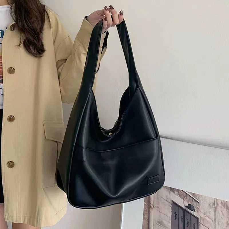 Large capacity tote bag, new black leather simple casual commuting women's bag, fashionable and versatile single shoulder bag