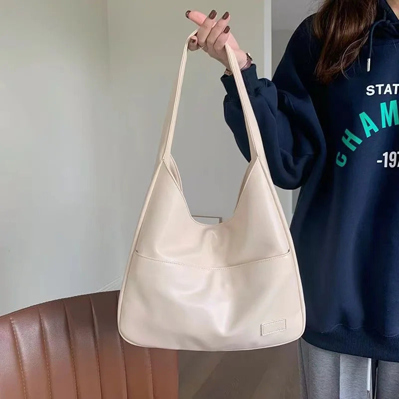 Large capacity tote bag, new black leather simple casual commuting women's bag, fashionable and versatile single shoulder bag