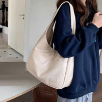 Large capacity tote bag, new black leather simple casual commuting women's bag, fashionable and versatile single shoulder bag