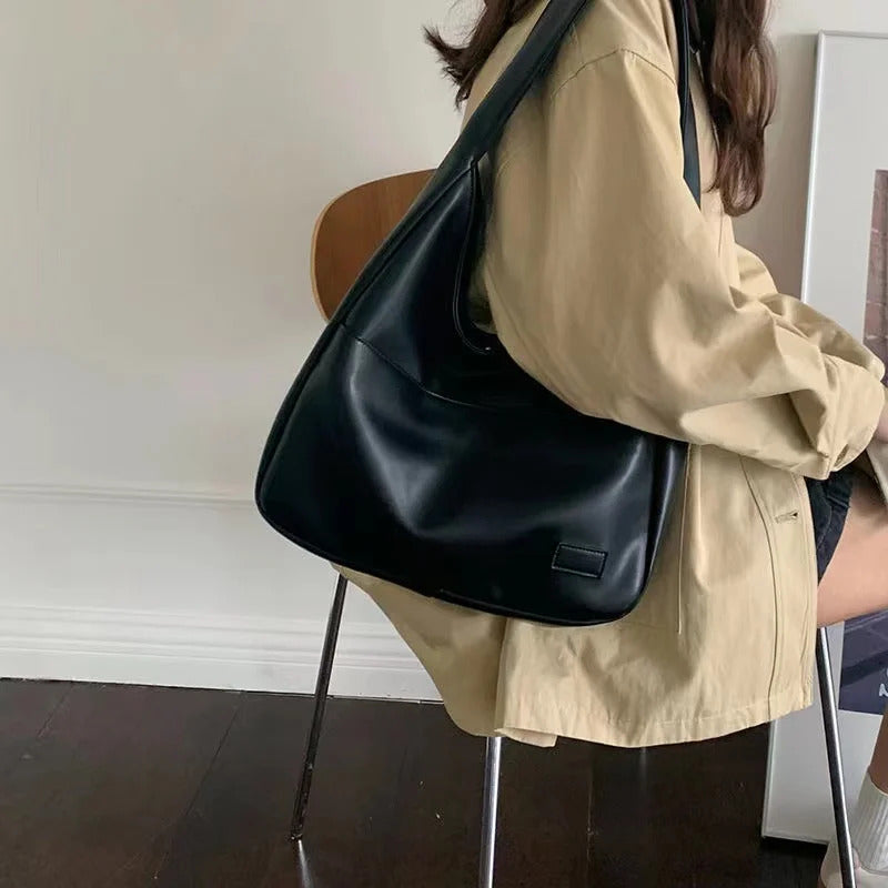 Large capacity tote bag, new black leather simple casual commuting women's bag, fashionable and versatile single shoulder bag